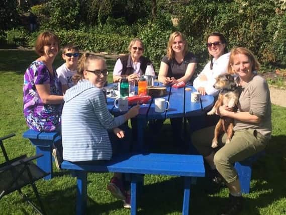 Under threat - Bilton volunteers pictured in 2017 at one of the picnic tables at Woodfield Millennium Green.