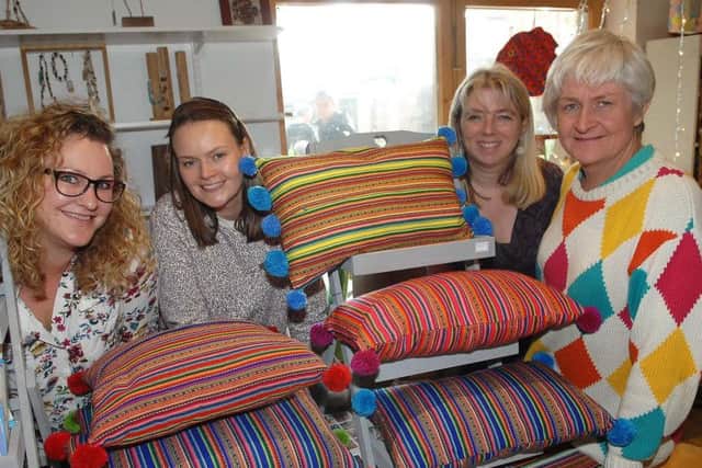 Jessica Lynch, Jemma Kennedy, Alison Hodgson and Barbara Leach on the Craft Aid International stall. (1811101AM3).