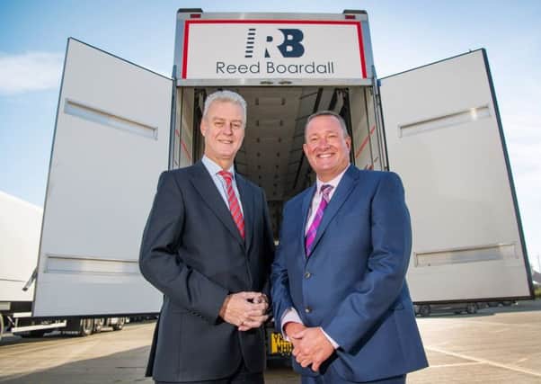Andrew Brown (left) of Gray & Adams, and Graeme Richardson of Reed Boardall with one of the companys new trailers.