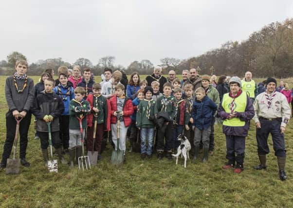 Cubs, Scouts and Guides are pictured with the mayors of Harrogate and Knaresborough and the many other people who helped plant the Peace Wood.