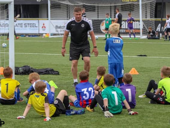 The soccer camp will be held at The CNG Stadium in January.
