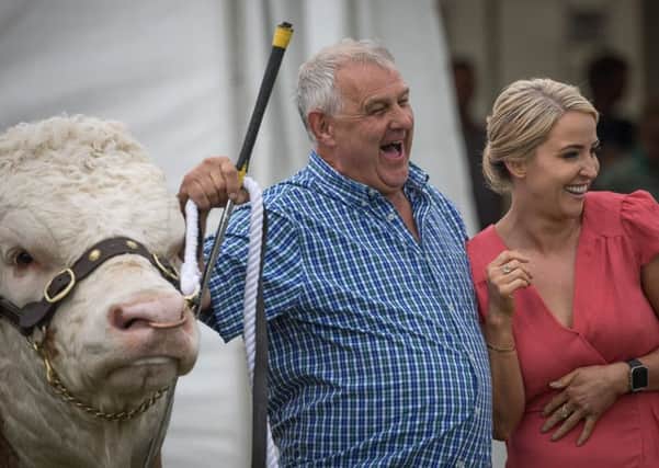 Soprano Lizzie Jones meets farmers and cattle before her sound check at the Great Yorkshire Show.