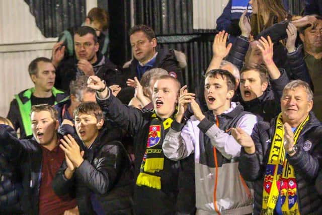 Town supporters enjoy their team's victory.
