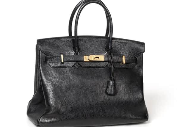This HermÃ¨s Black Leather Birkin Bag realised Â£5,000 at Tennants Auctioneers sale of Costume, Accessories and Textiles.