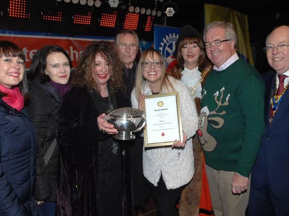 Flashback to the overall winner of last year's Christmas Shop Window competition in Harrogate as Georgina  Collins of Bijouled is presented with the winner's Rose Bowl by John Fox of The Harrogate at Christmas Group.