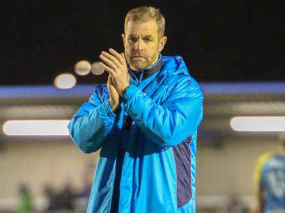 Simon Weaver applauds the travelling support at Solihull on Tuesday evening. Picture: Matt Kirkham