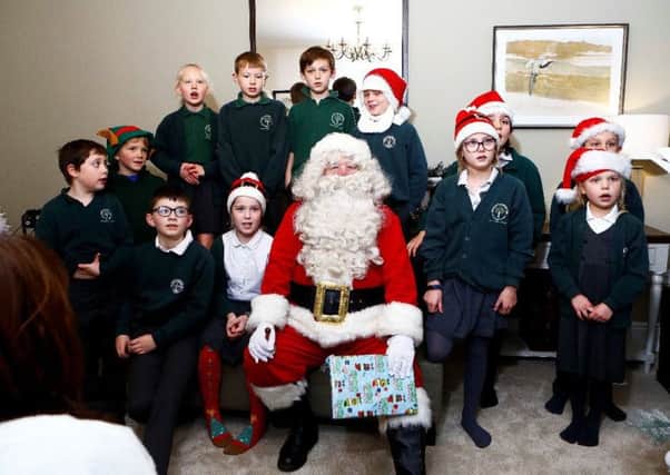 School children from Green Hammerton Church of England Primary School with Santa at the switch-on event.