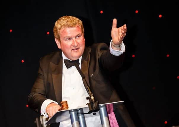 Auctioneer Richard Smailes in action at the Candlelighters ball.