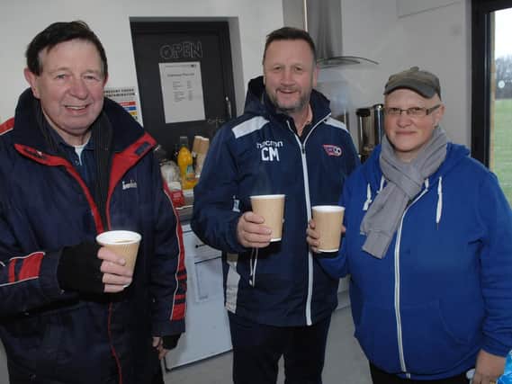 Club president Cliff Trotter, club chairman Chris McVey, and committee member Tracy D'Alessandro-Rixon enjoy a warm drink in the the club house. (1812151AM4)