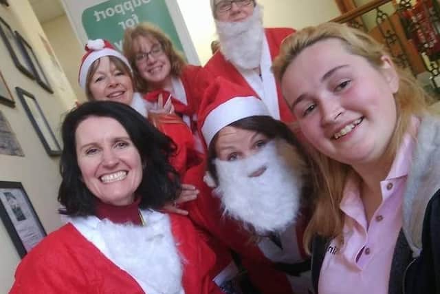 Last year's Ripon Christmas video: Organiser Lily Worth (right), with the Dementia Forward team who dressed up for the occasion.