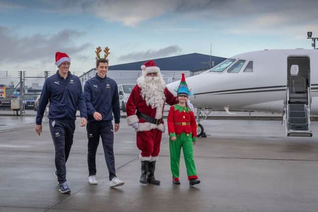 Date:19th December 2018.
Picture James Hardisty.
Yorkshire private aviation company Multiflight, based at South Side Aviation Centre at Leeds Bradford Airport were providing a special flight for online marketing company Infoserve, and a cast member from Emmerdale and two Yorkshire County Cricket Club stars to make it a Christmas to remember for children and their families at Martin House Childrens Hospice in Boston Spa, near Wetherby.
Multiflight provided a Dauphin helicopter from its fleet of VIP charter helicopters to fly Santa in with presents, along with one of his Santa helper's Edie Trutch, aged 10, a pupil at Collingham Primary School, and two of Yorkshire cricketers Steven Patterson and Matthew Fisher.