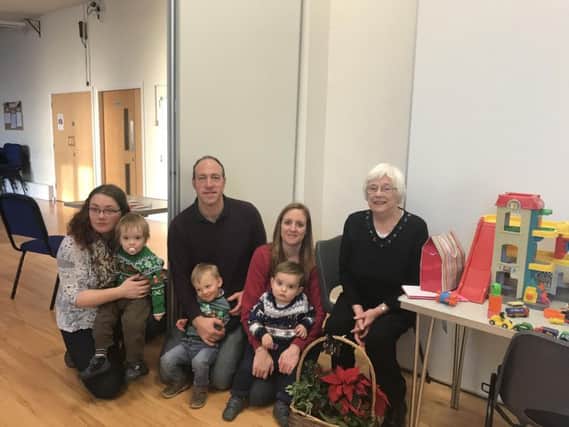 An inspiration to us all: Enid Bickerstaffe with parents and children at the playgroup.