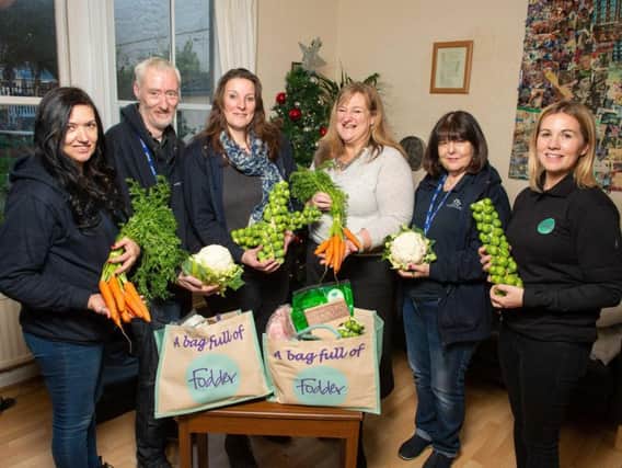 Helpers from Fodder at the Harrogate Homeless Project on Christmas Eve, including Heather Parry, Fodder's managing director (third from right) and Liz Hancock, the homeless charity's chief executive (third from left).