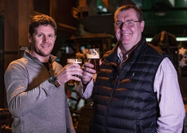 Black Sheep Brewery managing director Rob Theakston (left) and Black Sheep Brewery chairman Andy Slee (right) toast their company's acquisition of York Brewery from administration.