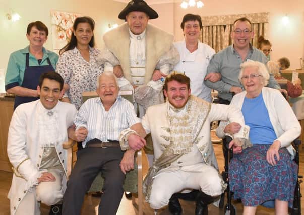 Fun and frolics at Highfield Care Home, Near Tadcaster.  Danny Rogers, Jack McGill, and John D Collins from Yorks Grand Opera House Pantomime Cinderella and the Lost Slipper, visited the Highfield Care Home, near Tadcaster, to have a cup of tea and a mince pie and a chat with the residents. Pictured front from the left are Danny Rogers, Tom Shepherd, Jack McGill, and Pauline Lloyd with Susan Harrison, back left, Fatima Buxton, John D Collins, Eve Goodger and Richard Sweeting. Picture by David Harrison/Grand Opera House.