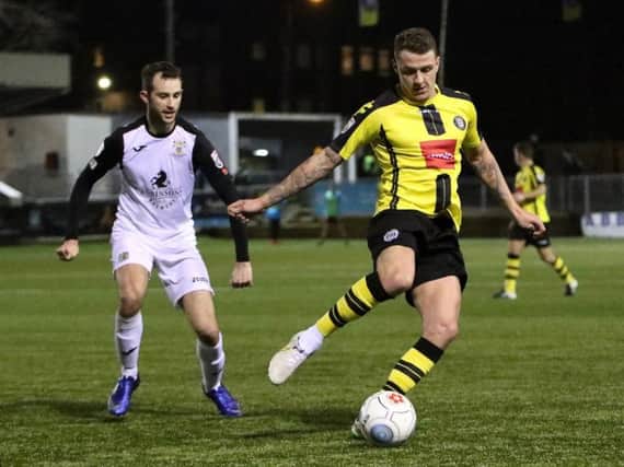 Harrogate Town's Joe Leesley in action against Stockport County during last season's clash at the CNG Stadium. Picture: Matt Kirkham