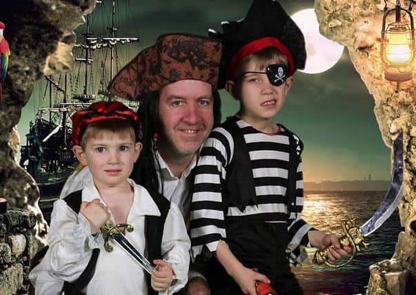Ashton and his brother James with a pirate from the panto