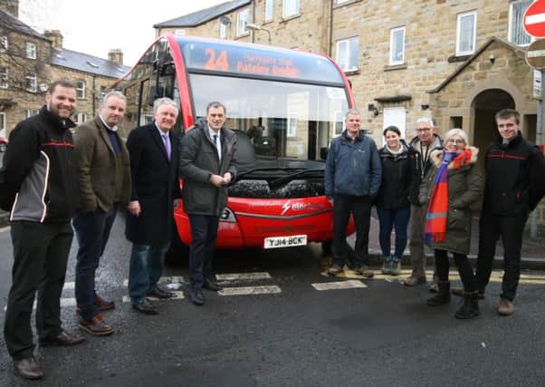 Julian Smith MP and various Pateley residents with members of the bus company and the National Trust.