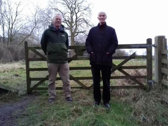 Residents Colin Elliff of Hartley Road and David Britain of Beckwith Road in Harrogate in front of the field which may become housing.