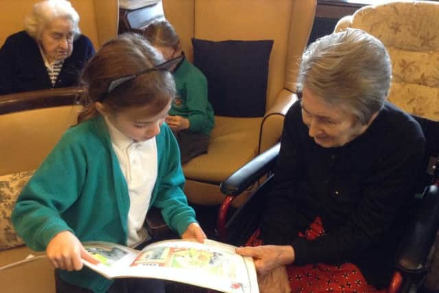 Pupils have been reading with Larchfield Manor residents.