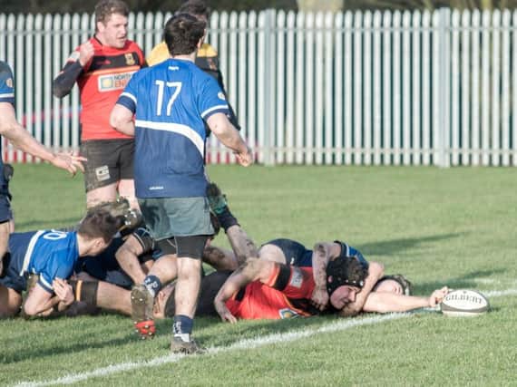 Hugh Tatlow stretches to register a try for Harrogate Pythons during Saturday's victory over Sheffield Medicals.