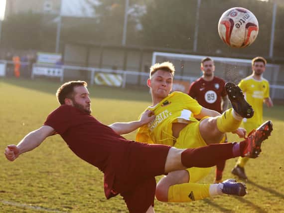 Knaresborough Town's Rob Worrall flies into a challenge during Saturday's loss at Worksop Town. Picture: Craig Dinsdale