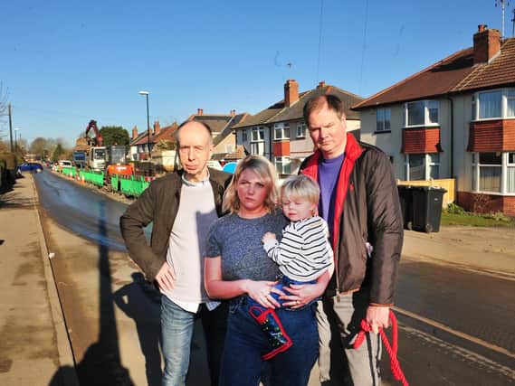 Residents annoyed at road closures caused by current house building in the Kingsley Road area of Harrogate: John Hansard, Victoria Newsome with her son Billy and Tim Redshaw. (Picture by Gerard Binks)
