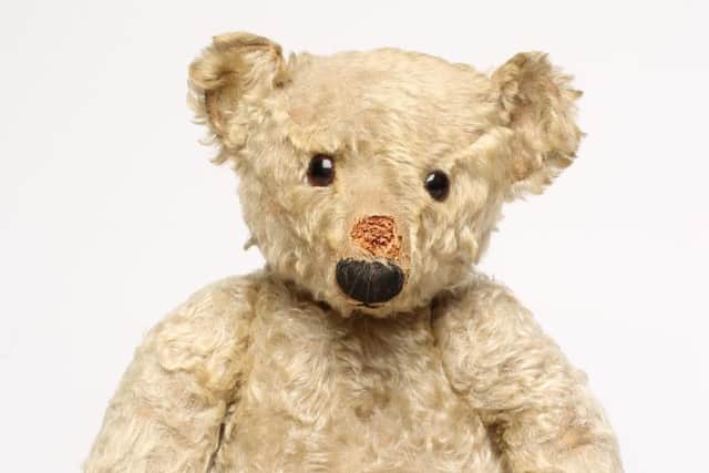 An early English teddy bear, estimate £400-£600.