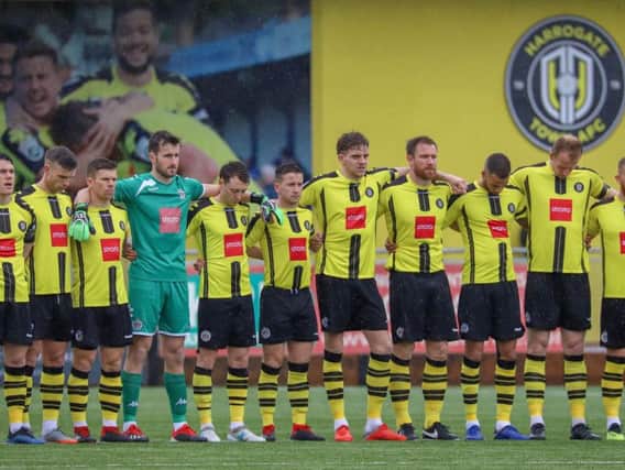 Harrogate Town line-up for Saturday's minute's silence in memory of former chairman Bill Fotherby. Pictures: Matt Kirkham