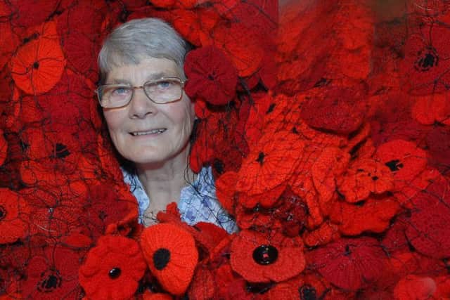 Hazel Barker with just some of the knitted poppies.
