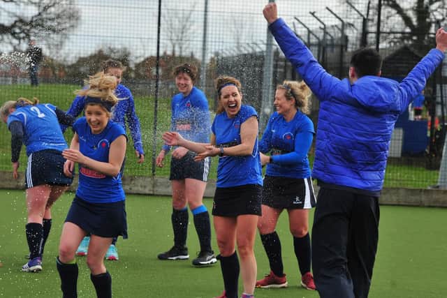 Harrogate Ladies 2s celebrate after Saturday's 2-1 victory over Wakefield, the win that saw them wrap up the title.