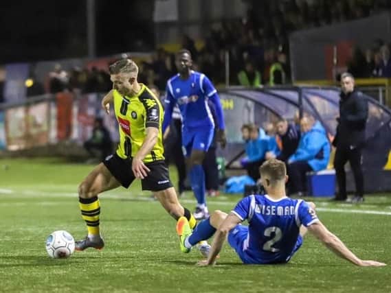 Jack Muldoon gets the better of Scott Wiseman during Harrogate Town's National League clash with Salford City. Picture: Matt Kirkham