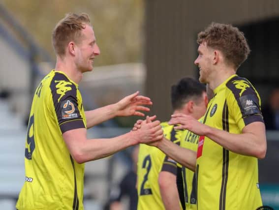 Mark Beck, left, is congratulated by Callum Howe after opening the scoring against Maidstone United. Picture: Matt Kirkham