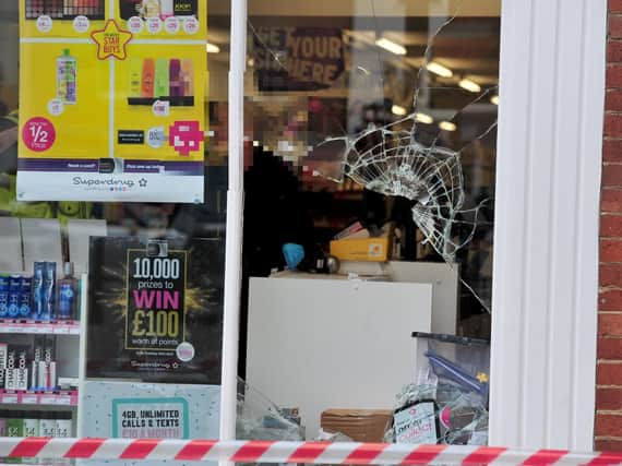 A window was smashed during the burglary. Picture: Gerard Binks.