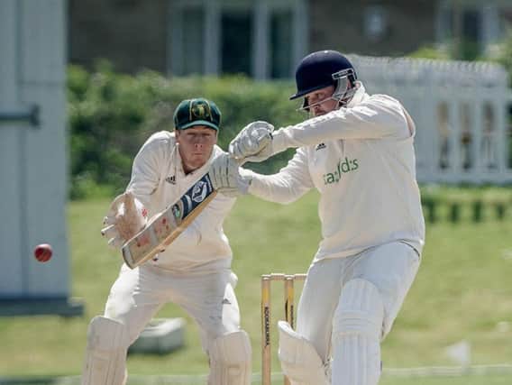 Harrogate CC captain Josh Atkinson hits out. Picture: Caught Light Photography