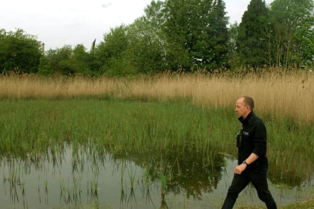 Jono Leadley, Director of Development for the Yorkshire Wildlidfe Trust walking by The Nursery pond at the new Yorkshire Wildlife Trust Ripon City Wetlands nature reserve, where reeds were grown to be transplanted around the rest of the nature reserve.