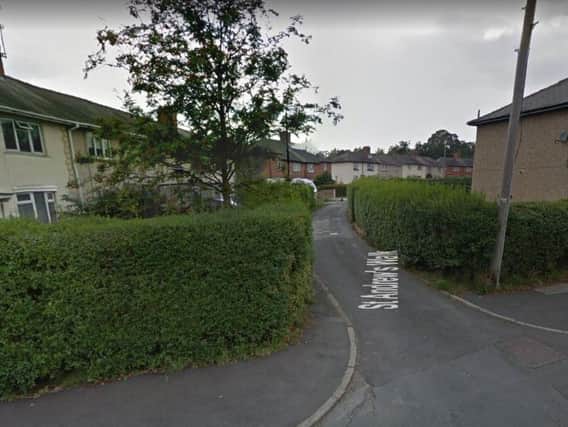 A delivery driver was robbed at knife-point near St Andrews Walk.