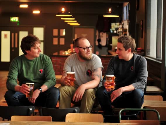 In the new tap room at Roosters' new Hornbeam Park premises - Roosters head brewer Oliver Fozard, taproom manager Josh Molloy and Roosters commercial manager Tom Fozard. (Picture by Gerard Binks)