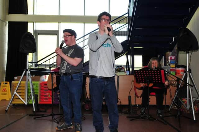 Pictured are Stevie Blair and Matthew Goddard singing at the event. Picture by Gerard Binks.
