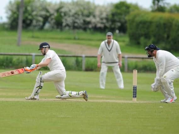 Birstwith captain Jon Millward hits out on his way to a big score with Goldsborough wicket-keeper Jon Jackson looking on. Picture: Gerard Binks