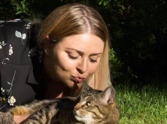 Naomi Walker and her much-loved cat Badger, who has become a local celebrity. Picture: Dan Ash.