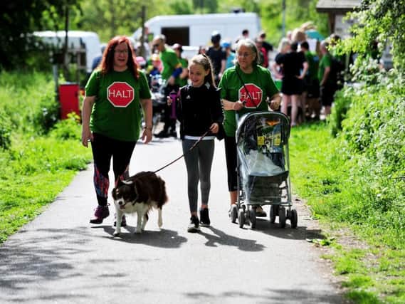 Three generations of campaigners against a Nidd Gorge relief road - From left Adele Laurie, Aysha Laurie aged 11 with Poppy the dog and Brenda Laurie at Andrew Jones MP's walk. (Picture: Gerard Binks)