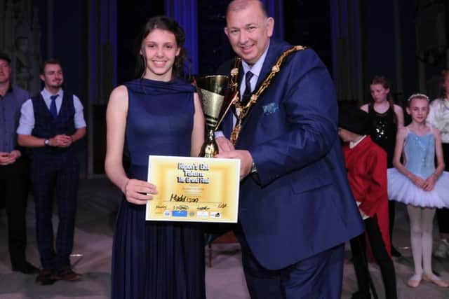 The Mayor of Ripon, Coun Eamon Parkin, presents Maddison with her audience vote prize. Picture: Gerard Binks.