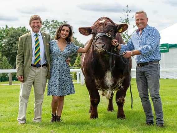 Great Yorkshire Show director Charles Mills with TV presenters Anita Rani and Jules Hudson with a Beef Shorthorn belonging to Tracy Severn from Halifax at the Great Yorkshire Showground. Picture by Bruce Rollinson.