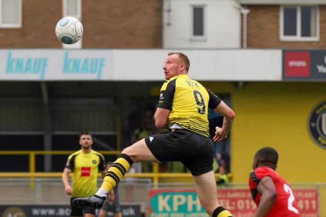 Harrogate Town's Mark Beck wins a header. Picture: Matt Kirkham