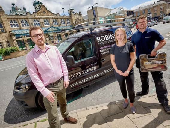 Success - Robinsons Facilities Services Luke Kitchen, managing director; Katie Challis, director; and Richard Parry, service engineer outside the Royal Hall and Harrogate Convention Centre.