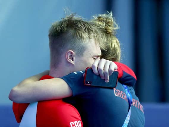 Harrogate diver Jack Laugher is consoled after missing out on a gold medal at the World Championships in South Korea. Picture: Getty Images