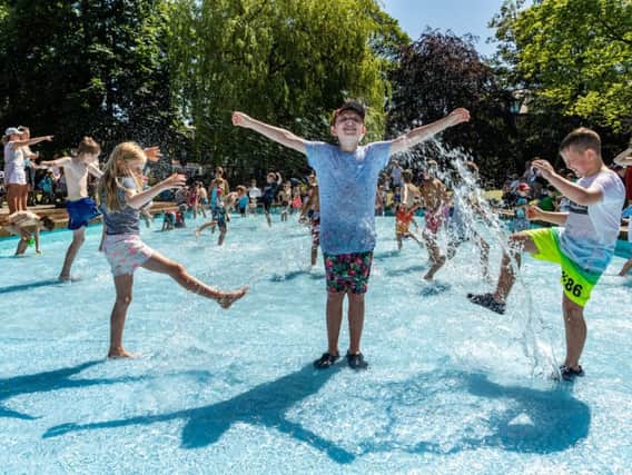 Lucy Bowman, 7, with her brother Alfie Bowman, 11, and friend Jack Simpson, 10, cooling down in the paddling pool in Valley Gardens as the heatwave hits Harrogate.