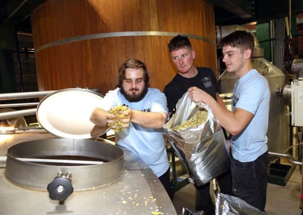 Former Black Sheep brewing apprentice Nick Norris (centre) with the firm's two latest apprentices, Jacob Slater and Matt Hunter in the brewhouse at Masham.