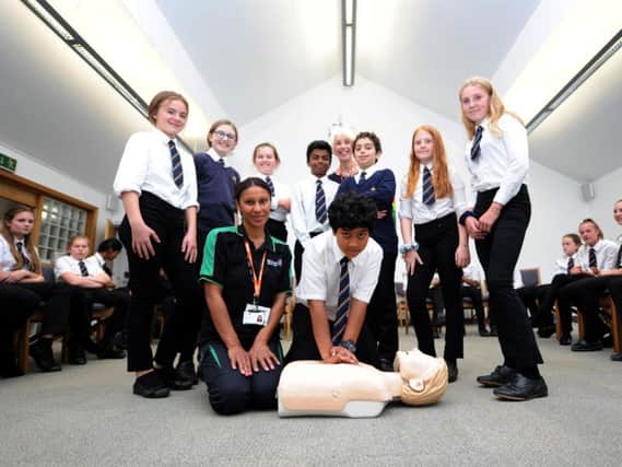 St John Ambulance first Aid training at St Aidan's High School, Harrogate.
Pictured: Caroline Kennedy-Drabble of St John Ambulance showing 12-year-old Dellan Wesley resuscitation techniques. Picture: Gerard Binks.